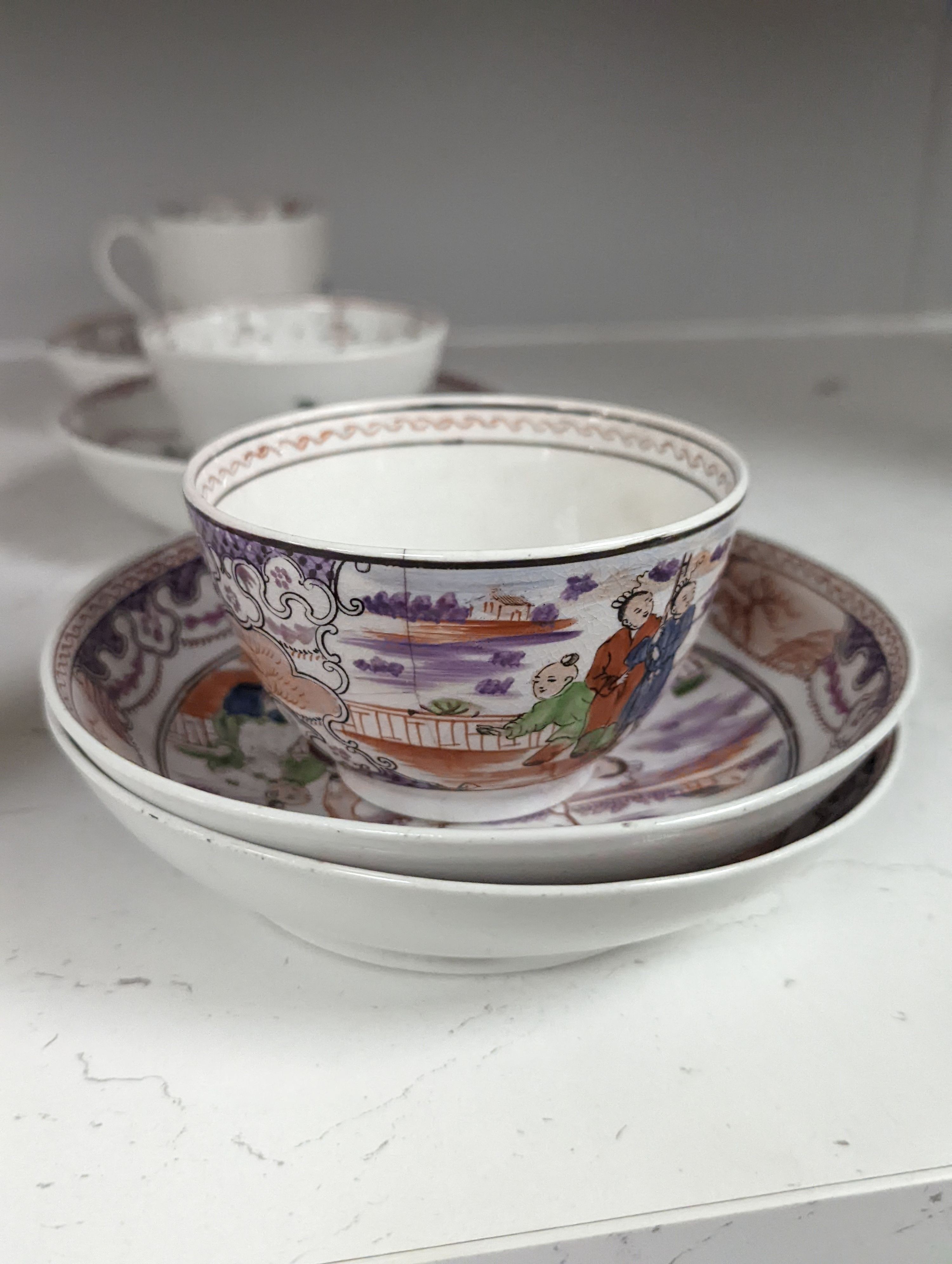 New Hall style study collection: a cream jug pattern 524, a teabowl and saucer with oriental figures, and another teabowl and saucer, a shankered teacup and saucer, two coffee cups, three teabowls, four saucers and a slo